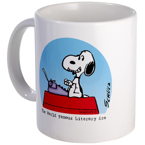 Snoopy writing ace on a mug