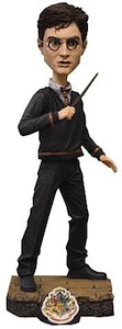 Neca Bobble Head of Harry Potter in school uniform.